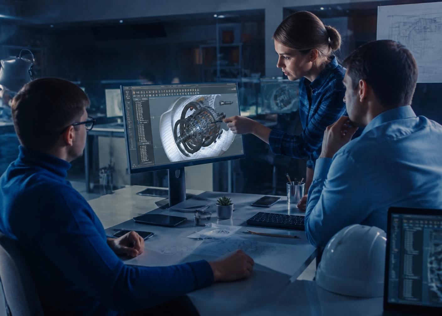 Ingénieurs du bureau d'études TUNITECH analysant une conception mécanique 3D